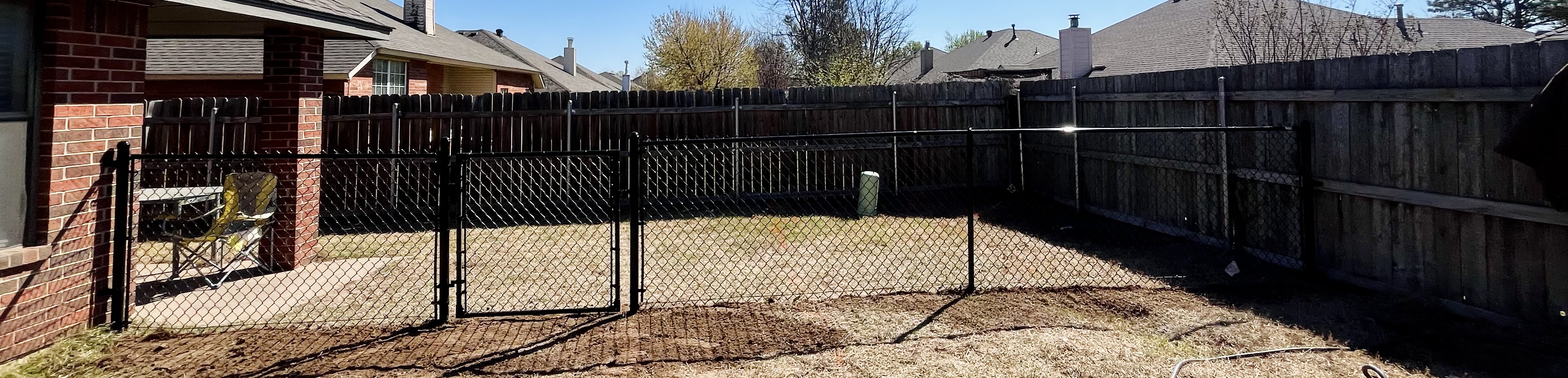 Black Chainlink Dog Area for local rescue foster in Norman, OK!