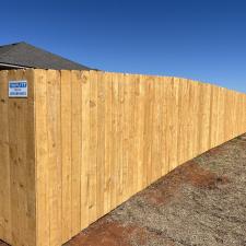 Happy-customers-and-a-beautiful-Pre-stained-Douglas-Fir-wood-fence-finalized-in-Yukon 3