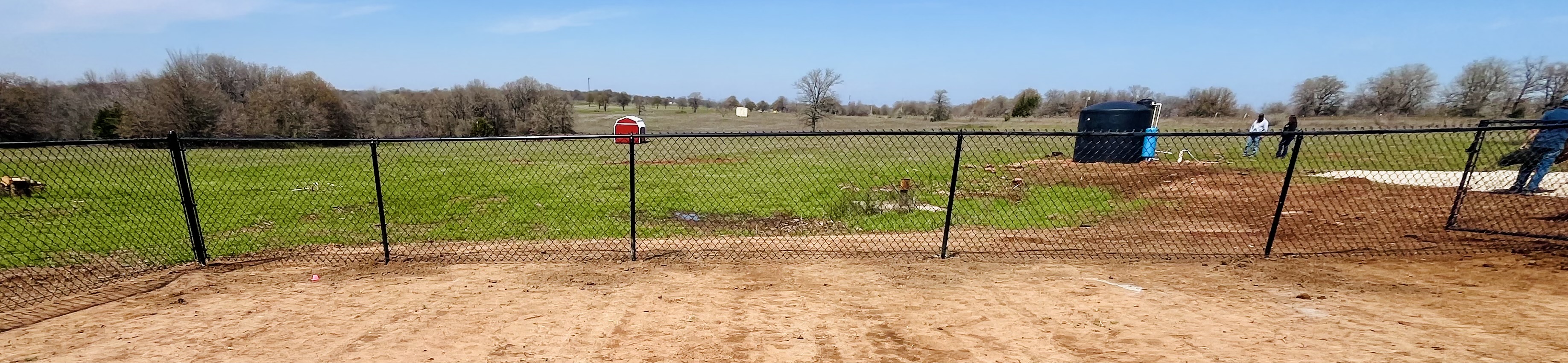 Large Black Chain Link Fence installation on a beautiful country property in Lindsay