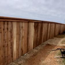 Perfectly-Crafted-customized-fence-installation-in-Midwest-City-Complete-with-a-personalized-dog-window-and-stainseal 3