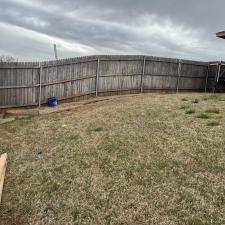 Perfectly-Crafted-customized-fence-installation-in-Midwest-City-Complete-with-a-personalized-dog-window-and-stainseal 4