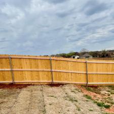 Strong-Pre-stained-Douglas-Fir-wood-fence-installation-finished-for-a-wonderful-military-family-in-Blanchard-OK 1